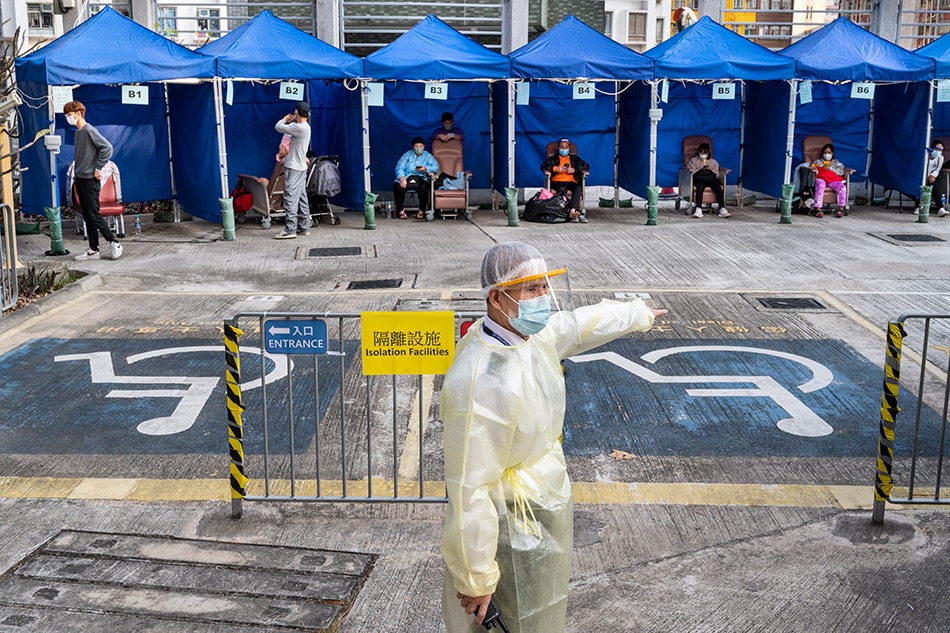 Patients wait to be treated at Caritas Medical Center after showing COVID-19 symptoms in Hong Kong, China, Feb. 15, 2022. Hong Kong's medical system has been overloaded by the fifth-wave COVID-19 outbreak. Miguel Candela, EPA-EFE