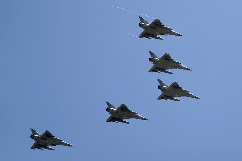 Taiwanese Dassault Mirage 2000 fighter jets fly over during National Day celebrations in Taipei, Taiwan, on October 10, 2021. Ritchie B. Tongo, EPA-EFE