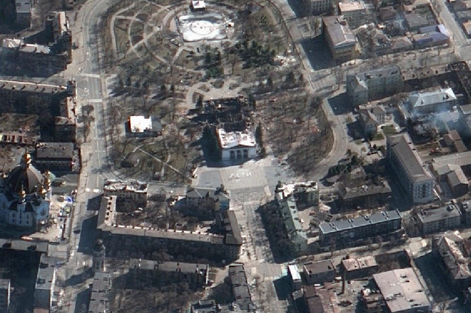 A handout satellite image made available by Maxar Technologies shows the aftermath of the airstrike on the Mariupol Drama Theater in Mariupol, Ukraine, on March 19, 2022. The besieged southern port city of Mariupol has seen Russian bombardments for over two weeks. EPA-EFE/Maxar Technologies handout