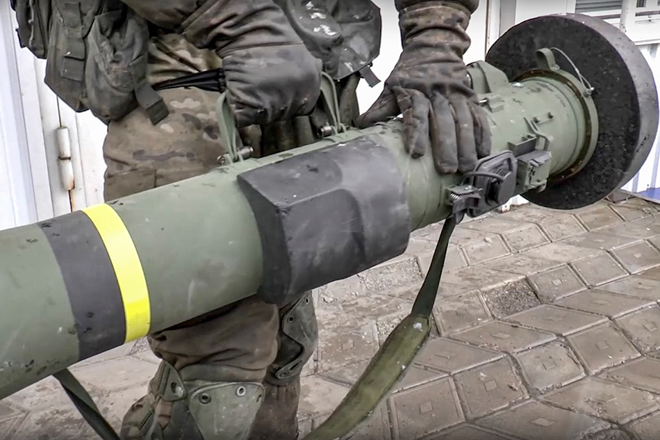 A handout still image taken from handout video made available by the Russian Defense ministry press-service shows a militia of self-proclaimed DNR holds NLAW Swidish-UK made Light Anti-tank Weapon that was abandoned by Ukrainian army during their retreat in Donetsk region, Ukraine, 16 March 2022. On 24 February Russian troops had entered Ukrainian territory in what the Russian president declared a 'special military operation', resulting in fighting and destruction in the country, a huge flow of refugees, and multiple sanctions against Russia. EPA-EFE/RUSSIAN DEFENCE MINISTRY PRESS SERVICE/HANDOUT