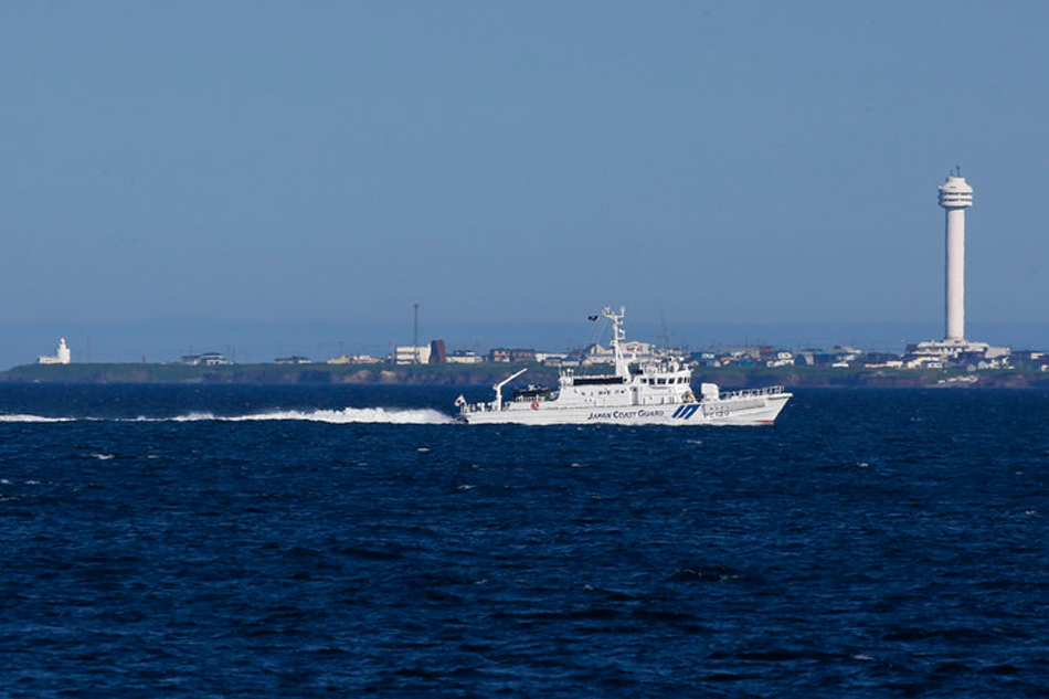 A Japan Coast Guard vessel patrols off Cape Nosappu, near the southernmost Kuril island Kunashir Island, under Russian administration and claimed by Japan, near Nemuro, on Hokkaido island, on July 13, 2013. Kimimasa Mayama, EPA/file