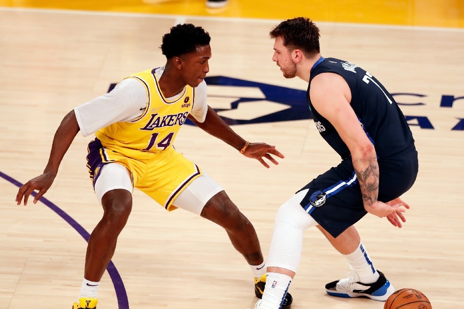 Dallas Mavericks guard Luka Doncic (R) in action against Los Angeles Lakers guard Stanley Johnson (L) during the third quarter of the NBA game between the Los Angeles Lakers and the Dallas Mavericks at the Crypto.com Arena in Los Angeles, California, USA, 01 March 2022. Etienne Laurent, EPA-EFE