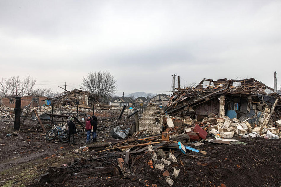 Women stand next to houses destroyed during the Russian invasion, in Boromlia village, at Trostyanets district which was recaptured by the Ukrainian army, in Sumy region, Ukraine, March 30, 2022. Roman Pilipey, EPA-EFE 