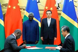 Australia accuses China of paying bribes to win deals