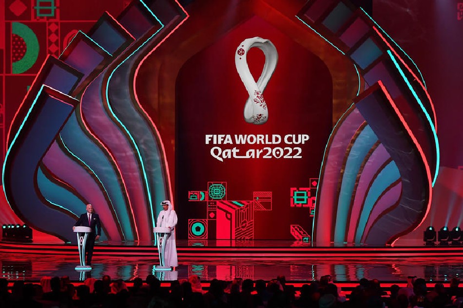 FIFA president Gianni Infantino (left) and the Emir of Qatar Sheikh Tamim bin Hamad al-Thani on stage at the start of the main draw for the FIFA World Cup 2022 in Doha, Qatar, April 1, 2022. Noushad Thekkayil, EPA-EFE