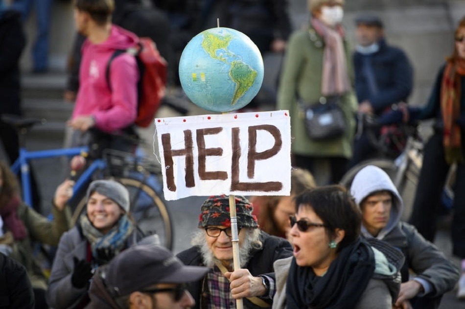 People take part in a demonstration to demand actions from world leaders against climate change, in Lausanne, Switzerland, Nov. 6, 2021. Laurent Gillieron, EPA-EFE/File