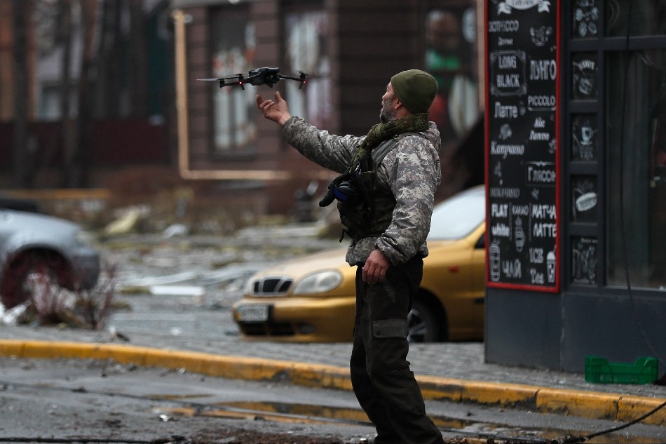 Ukrainian serviceman flies his drone in the city of Irpin, near Kyiv, Ukraine, 02 April 2022. Russian troops entered Ukraine on 24 February resulting in fighting and destruction in the country, and triggering a series of severe economic sanctions on Russia by Western countries. EPA-EFE/ATEF SAFADI