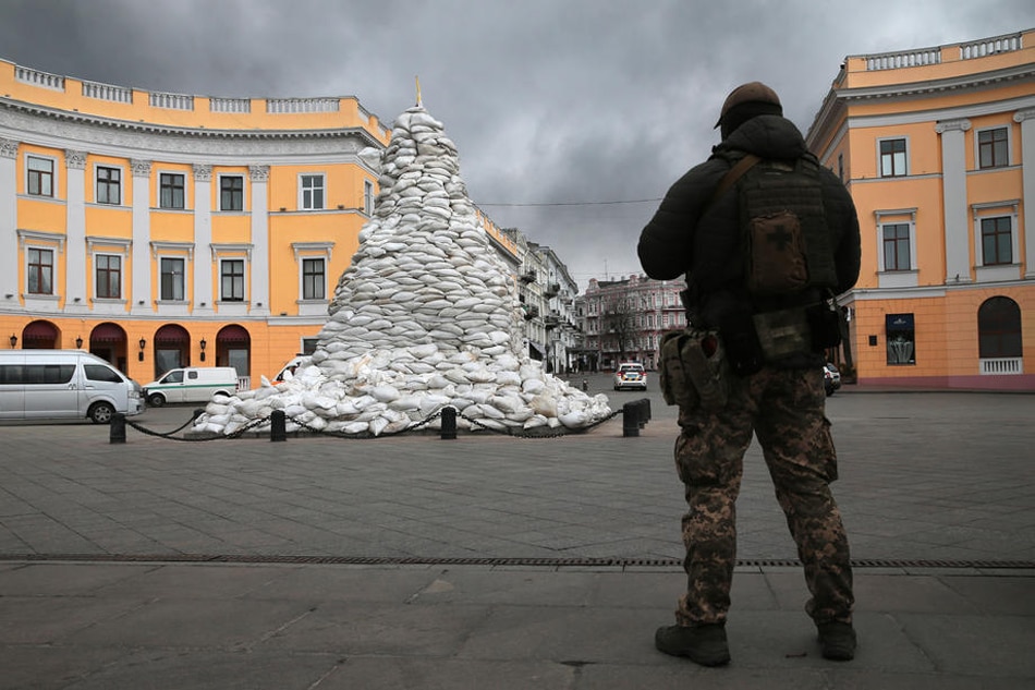 A soldier stands guard near the monument to the Duke of Richelieu covered with sandbags in Odesa, Ukraine, April 3, 2022. EPA-EFE/George Vitsaras/file