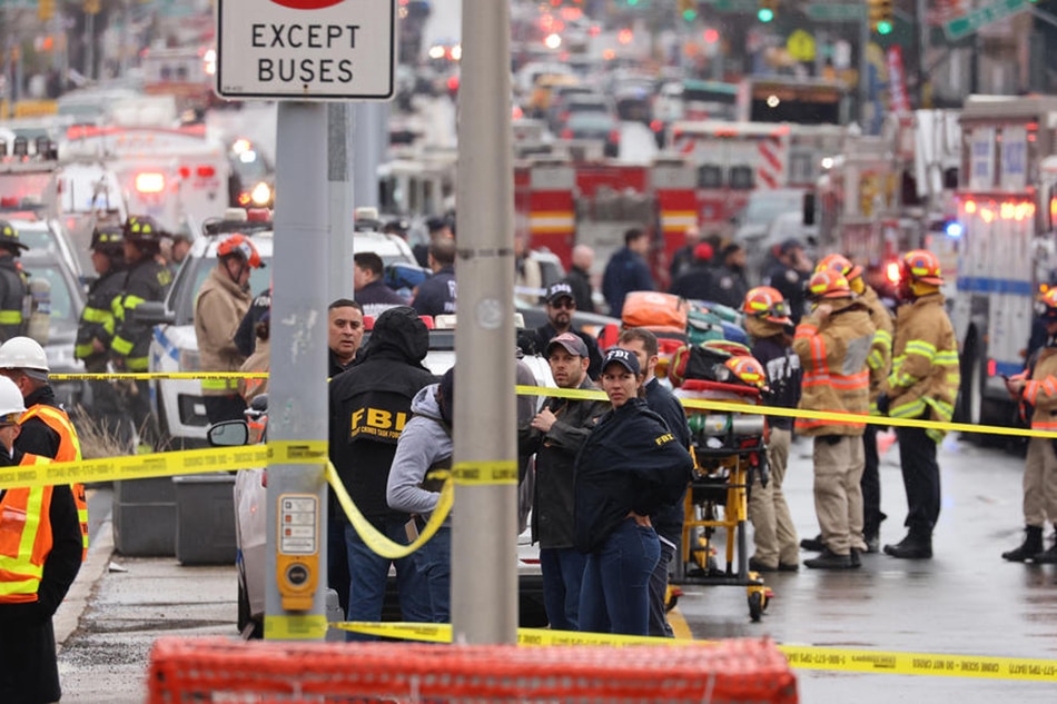 New York City Police and Fire Department officials on the scene of a reported multiple shooting at a New York City Subway station in the Brooklyn borough of New York, New York, USA, April 12, 2022. Justin Lane, EPA-EFE 