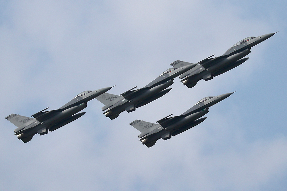 Taiwan Air Force F-16v fighter jets flyby during the Taiwan Air Force F-16V commission ceremony inside the airbase of Chiayi, Taiwan, November 18, 2021. President Tsai attend the commissioning of the Air Force’s first 42 F-16V upgraded fighter jets. Taiwan has purchased 66 new F-16Vs from the United States. While waiting for the arrival of the aircraft, the Taiwan air force has been upgrading the electronics system of its 141 F-16A/B aircraft to F-16Vs. EPA-EFE/Ritchie B. Tongo/File