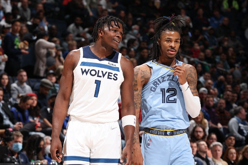 Wolves guard Anthony Edwards and Grizzlies guard Ja Morant during their game on February 24, 2022. David Sherman/NBAE via Getty Images/AFP/file