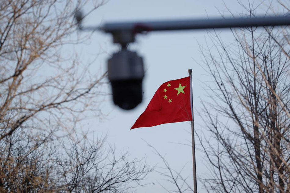 A Chinese national flag outside the Beijing No. 2 Intermediate People's Court in Beijing, China, March 31, 2022. Mark R. Cristino, EPA-EFE/File 
