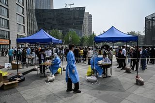 Beijing residents queue for COVID-19 test