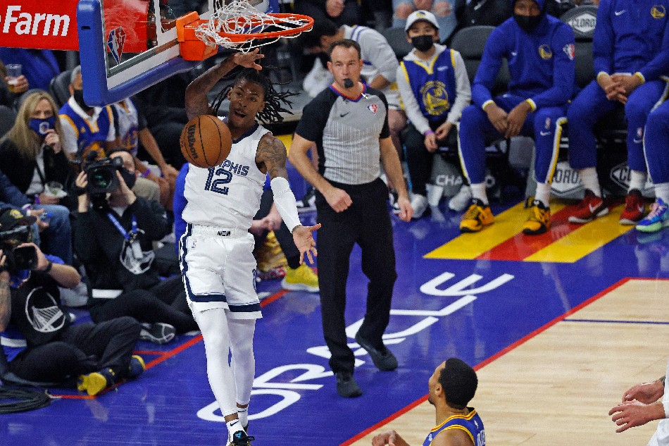 Memphis Grizzlies guard Ja Morant (L) slam dunks the ball for two points against the Golden State Warriors during the first half of their NBA game at Chase Center in San Francisco, California, USA, 23 December 2021. File photo. John Mabanglo, EPA-EFE