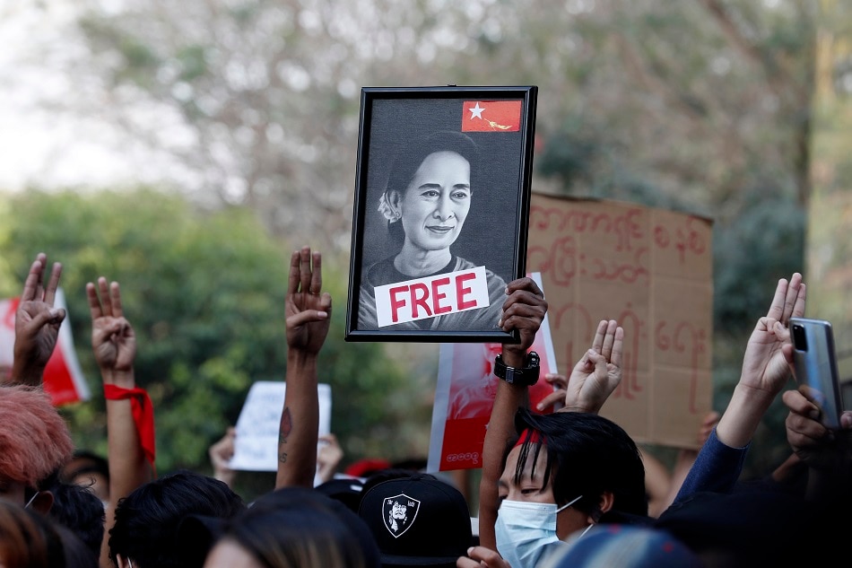 Demonstrators hold a portrait of detained State Counselor Aung San Suu Kyi during an anti-military protest at Hledan junction in Yangon, Myanmar, February 8, 2021. EPA-EFE stringer/file