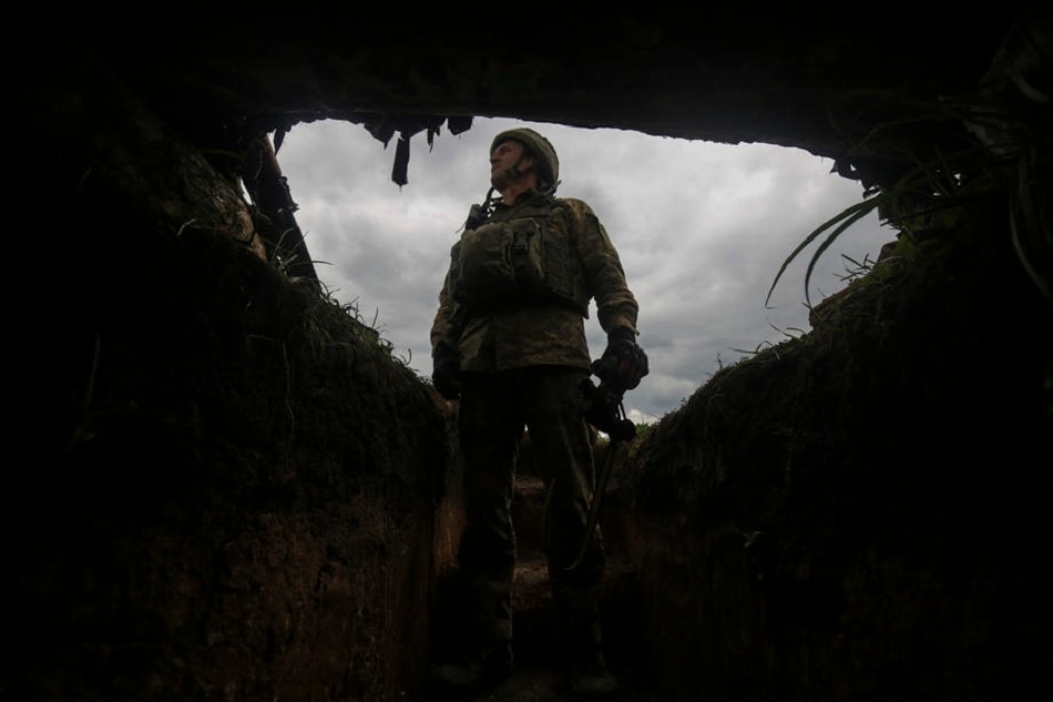 A Ukrainian serviceman inspects the situation at their positions near the New York village of Donetsk area, Ukraine, April 29, 2022, amid the Russian invasion. STR, EPA-EFE
