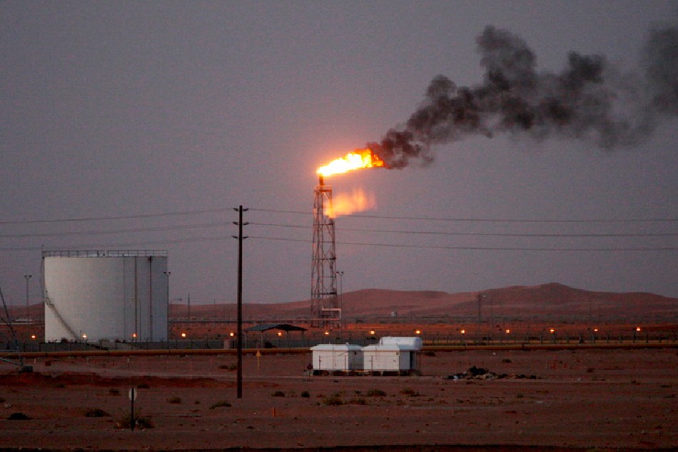 A gas flame seen in the desert at Khurais oil field, about 160 km from Riyadh, Kingdom of Saudi Arabia, 23 June 2008. Ali Haider/EPA-EFE file