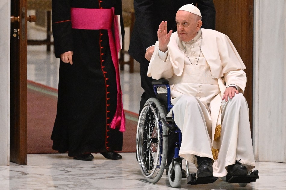 Pope Francis arrives on wheelchair during the audience to the Participants to Plenary Assembly of the International Union of Superiors General on May 5, 2022 in the Paul VI hall at the Vatican. Alberto Pizzoli, AFP/File