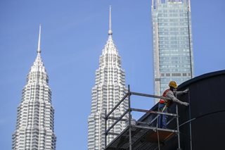 Malaysia central bank hikes interest rate to tame inflation