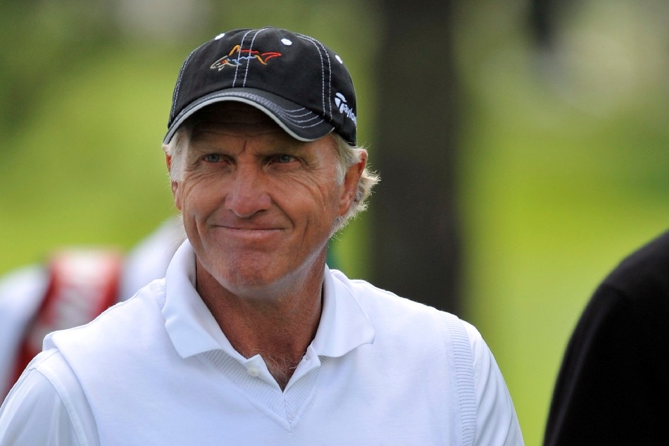 Greg Norman of Australia reacts to the gallery on the third hole during the first day of practice for the 2009 Masters Tournament at Augusta National in Augusta, Georgia, USA 06 April 2009. File photo. John G. Mabanglo, EPA