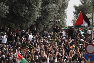 Violence clouds funeral of Al Jazeera journalist
