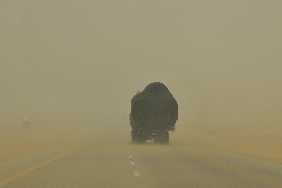 A lorry heads into a sand storm along the highway in the desert region of al-Hasa, some 370 km east of the Saudi capital Riyadh, on June 16, 2013. Fayez Nureldine, AFP/file