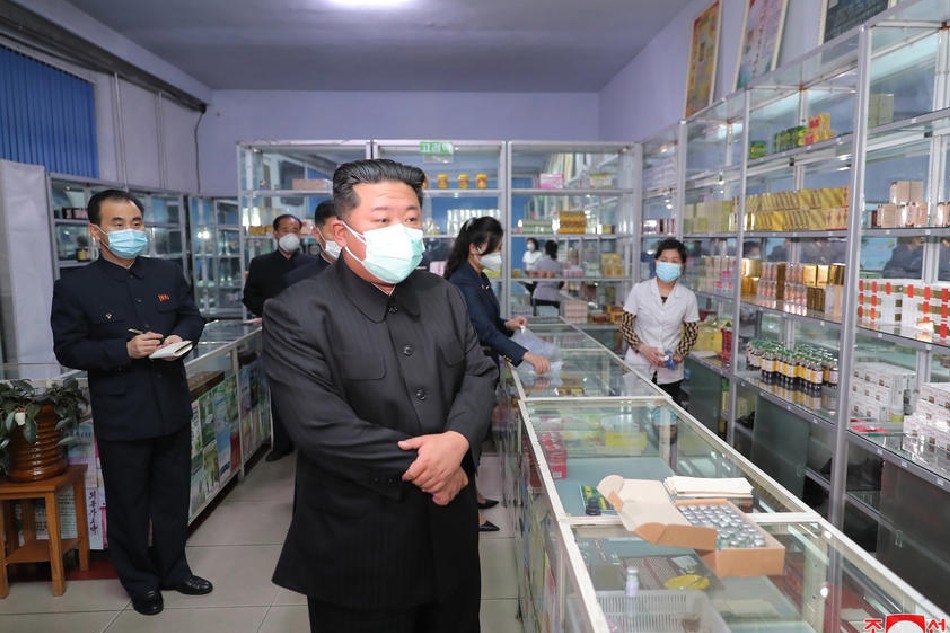 A photo released by the official North Korean Central News Agency (KCNA) shows North Korean leader Kim Jong-un (C) wearing a face mask while inspecting a pharmacy in Pyongyang, North Korea, May 15, 2022 (issued May 16). On 15 May, Kim held an emergency consultative meeting of the political bureau of the Workers' Party at the headquarters of the party's Central Committee in Pyongyang. In the meeting, Kim ordered the mobilization of soldiers to stabilize the supply of medicine in the capital. EPA-EFE/KCNA 