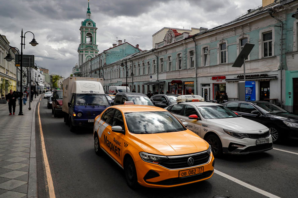 Vehicles travel on a street in Moscow, Russia, on May 13, 2022. Yuri Kochetkov, EPA-EFE/file