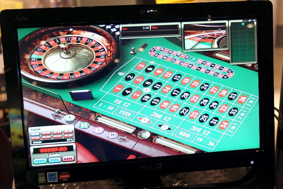 A screen broadcasts a virtual roulette table during Monaco's first professional online gaming and betting convention on October 11, 2010 at the Grimaldi forum in Monaco. This convention features a professional trading market, bringing together executives from the online gambling community, a series of conferences, and an awards ceremony. AFP PHOTO