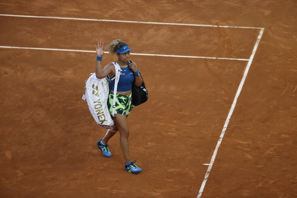 Japan's tennis player Naomi Osaka leaves the court after losing against Spain's Sara Sorribes during their women's singles round of 32 match at the Mutua Madrid Open's tennis tournament at the Caja Magica in Madrid, Spain, 01 May 2022. Juanjo Martin, EPA-EFE