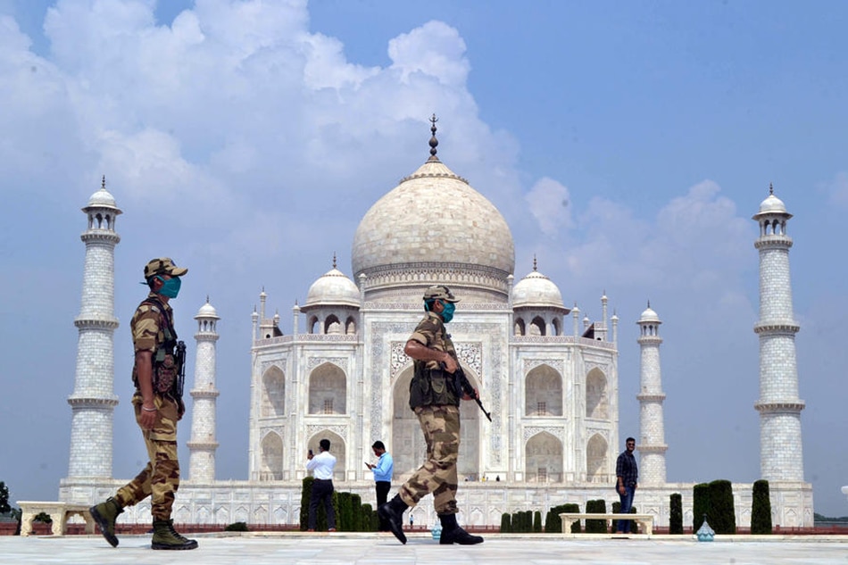 Indian security personnel stand guard at the Taj Mahal in Agra, Uttar Pradesh, India, on September 21, 2020. EPA-EFE/STR/file