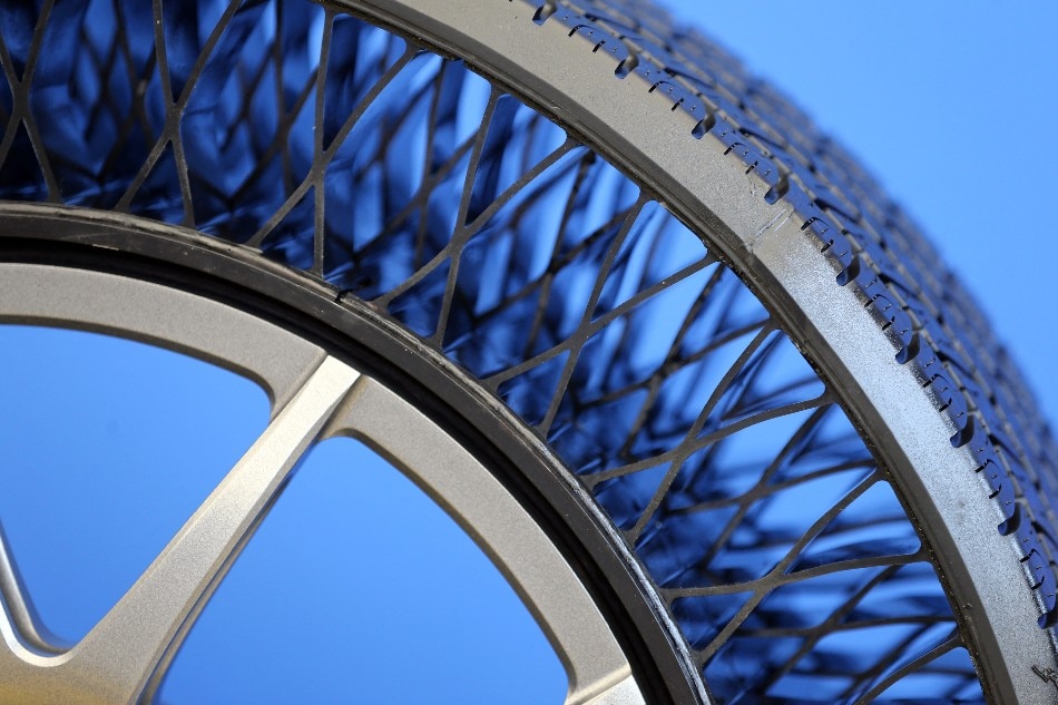A picture shows a non-pneumatic tyre (NPT), an airless tyres, during the presentation of the NPT tyre of Goodyear in Colmar-Berg, Luxembourg, on May 17, 2022. No flats and you never need to put air in them make the concept of airless tyres a dream for drivers, and manufacturers say they may soon hit the road for trucks before finally becoming available for cars. The thin layer of rubber gripping the asphalt has a gargantuan physical challenge to meet: supporting the weight of the car and absorbing shocks as well as standard tyres filled with air for thousands and thousands of kilometers. François WALSCHAERTS / AFP