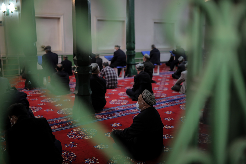 Uyghurs and other faithful pray in Id Kah Mosque in Kashgar in western China's Xinjiang Uyghur Autonomous Region during a government organized trip for foreign journalists, Kashgar, China, on April 19, 2021. Wu Hong, EPA-EFE/file