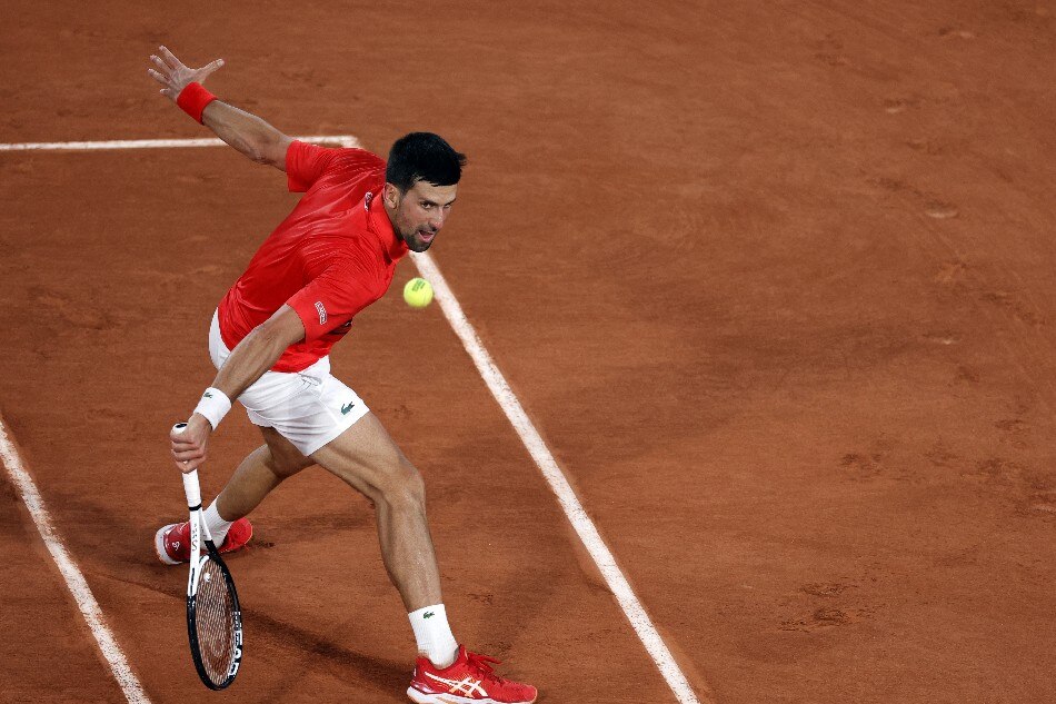 Novak Djokovic of Serbia plays Yoshihito Nishioka of Japan in their men’s first round match during the French Open tennis tournament at Roland ​Garros in Paris, France, 23 May 2022. Yoan Valat, EPA-EFE