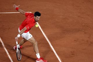 Tennis: Djokovic wins on Slam return as Nadal strolls