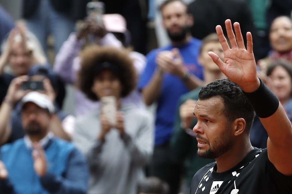 Jo-Wilfried Tsonga of France reacts after losing Casper Ruud of Norway in their men’s first round match and ending his career during the French Open tennis tournament at Roland ​Garros in Paris, France, 24 May 2022. Christophe Petit Tesson, EPA-EFE