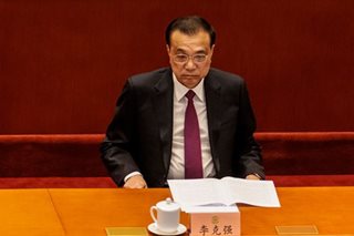 China premier issues warning on COVID-hit economy