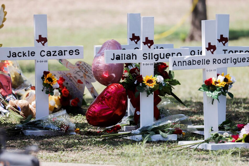Balloons, flowers, and messages are attached to crossed bearing the names of victims following a mass shooting at the Robb Elementary School in Uvalde, Texas, May 26, 2022. Tannen Maury, EPA-EFE
