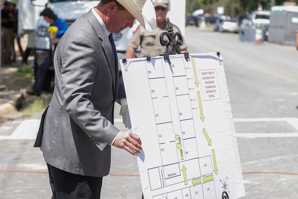 A law enforcement officer displays a graphic showing the route taken by gunman Salvador Ramos into Robb Elementary School in Uvalde, Texas, USA, May 27, 2022. According to Texas officials, at least 19 children and two adults were killed in the shooting on May 24. The eighteen-year-old gunman was killed by responding officers. Tannen Maury, EPA-EFE
