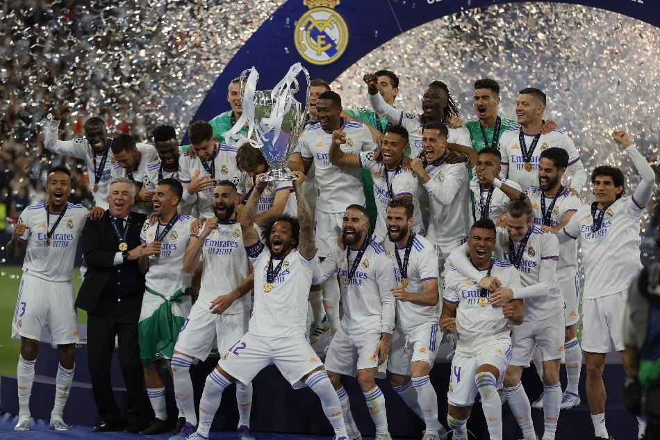 Players of Real celebrate after winning the UEFA Champions League final between Liverpool FC and Real Madrid at Stade de France in Saint-Denis, near Paris, France, 28 May 2022. Ronald Wittek, EPA-EFE