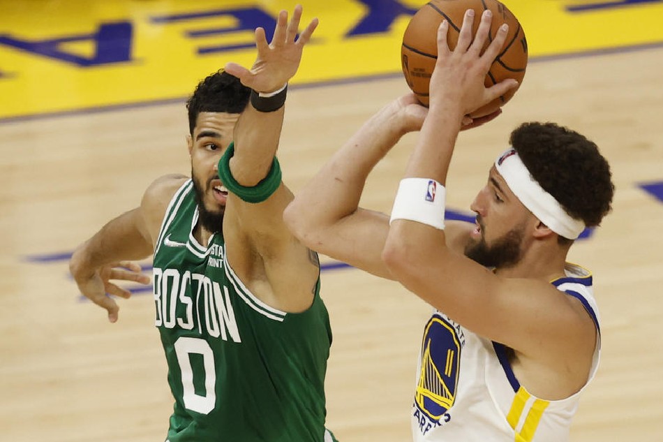 Warriors guard Klay Thompson and Celtics forward Jayson Tatum in action in Game 1 of the NBA Finals on June 2, 2022. John G Mabanglo, Shutterstock Out/EPA-EFE