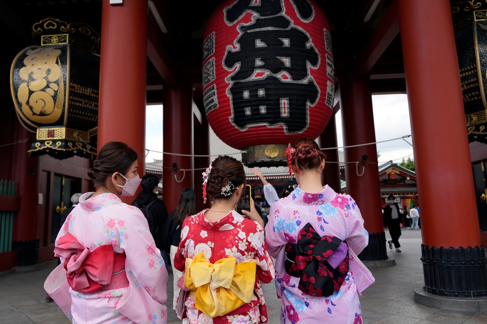Kimono-clad young women take pictures around the Sensoji temple at Asakusa district in Tokyo, Japan, 2 May 2022. For the first time in three years, people can enjoy the Golden Week holiday across the country without the restrictions of a coronavirus state of emergency. Franck Robichon, EPA-EFE
