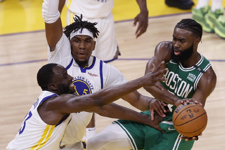 Celtics guard Jaylen Brown, Warriors forward Draymond Green, and Warriors center Kevon Looney in action in Game 3 of the NBA Finals. John G Mabanglo, Shutterstock Out/EPA-EFE