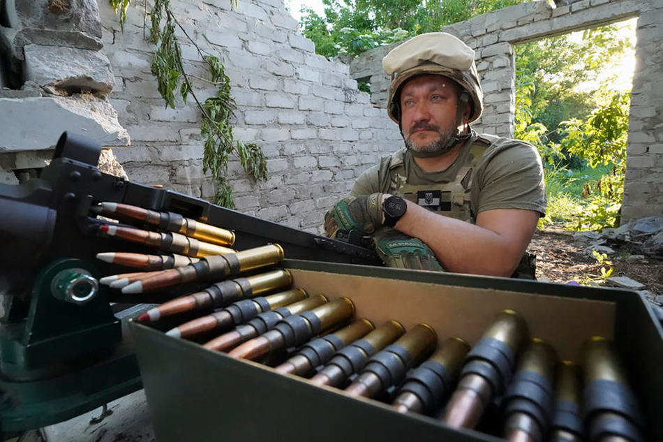 Ukrainian serviceman at his position on a front line in Kharkiv area, Ukraine, June 9, 2022. Vasiliy Zhlobsky, EPA-EFE