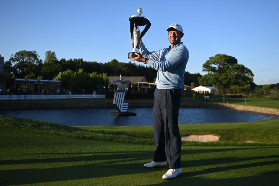 Charl Schwartzel of South Africa poses with the trophy after winning the LIV Golf Invitational Series at the Centurion Golf Club in St. Albans, Britain, 11 June 2022. Neil Hall, EPA-EFE.