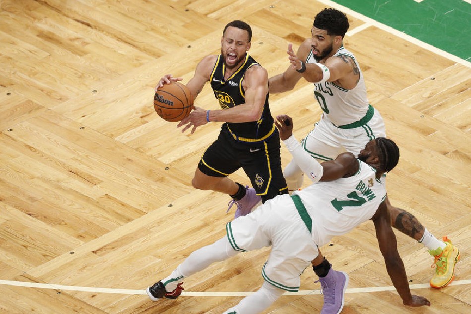 Warriors guard Steph Curry, Celtics forward Jayson Tatum, and Celtics guard Jaylen Brown in action in Game 4
