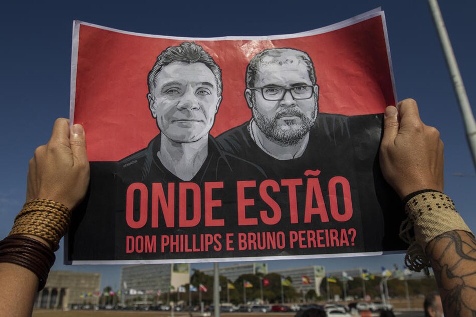 Employees of the National Indian Foundation (Funai) participate in a protest to reject the statements of the president of Funai, Marcelo Augusto Xavier da Silva, about the disappearances of British journalist Dom Phillips (L on poster), a contributor to The Guardian newspaper, and the Brazilian indigenista Bruno Pereira Araujo (R on poster), in front of the Ministry of Justice and Public Security in Brasilia, Brazil, June 14, 2022. Joedson Alves, EPA-EFE