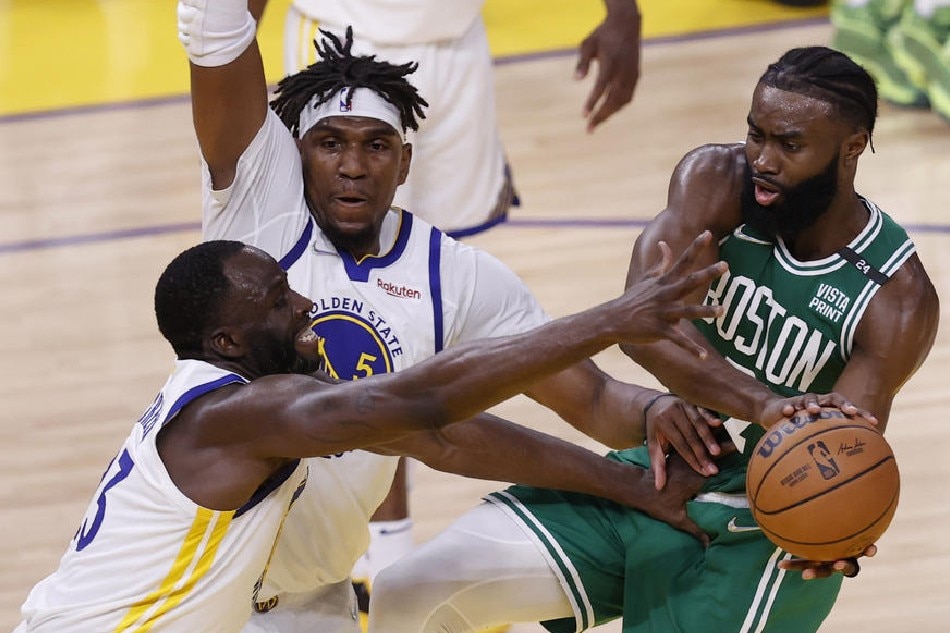 Celtics guard Jaylen Brown, Warriors forward Draymond Green, and Warriors center Kevon Looney in action in Game 2 of the NBA Finals on June 5, 2022. John G Mabanglo, Shutterstock Out/EPA-EFE