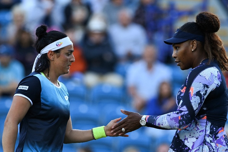 Serena Williams of the US (R) and Tunisia's Ons Jabeur react as they play against Japan's Shuko Aoyama and Tawain's Chan Hao-ching during their women's doubles quarter final tennis match on day four of the Eastbourne International tennis tournament in Eastbourne, southern England on June 22, 2022. Glyn Kirk, AFP.