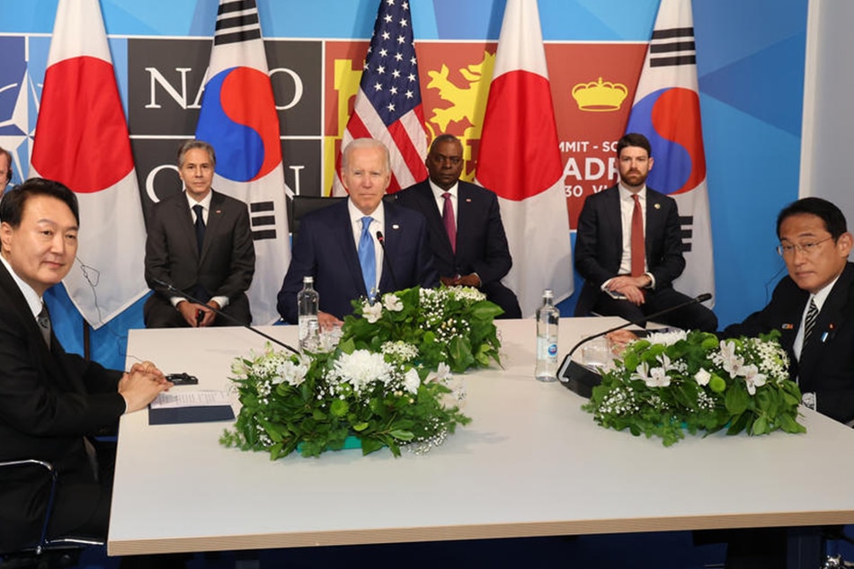 South Korean President Yoon Suk-yeol (left), US President Joe Biden and Japanese Prime Minister Fumio Kishida attend a trilateral meeting on the first day of the NATO summit at IFEMA congress center in Madrid, Spain, 29 June 2022. Heads of State and Government of NATO's member countries and key partners are gathering in Madrid from 29 to 30 June to discuss security concerns like Russia's invasion of Ukraine and other challenges. Yonhap South Korea Out, EPA-EFE